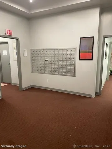 a view of a room with wooden floor and windows