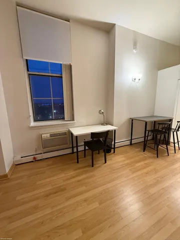 a view of dining room with furniture and window