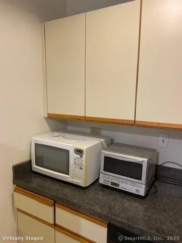 a stove top oven sitting inside of a kitchen