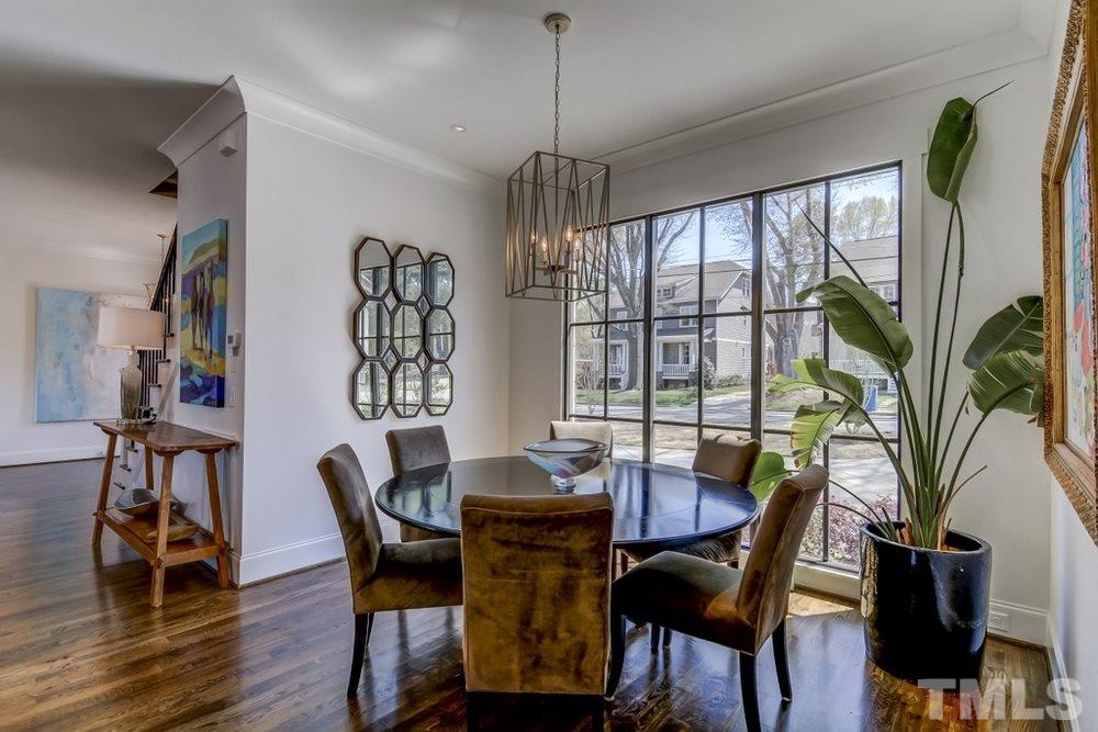 503 Peebles Street Raleigh, NC 27608 - Photo 3 of 30 a view of a dining room with furniture window and wooden floor