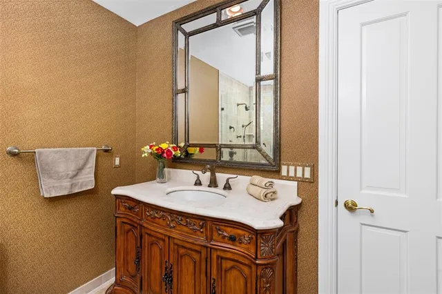 a bathroom with a sink and a mirror
