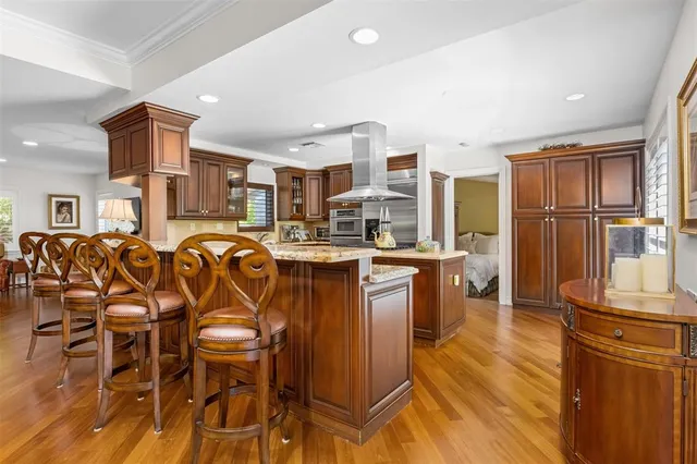 a kitchen with stainless steel appliances a sink stove and refrigerator