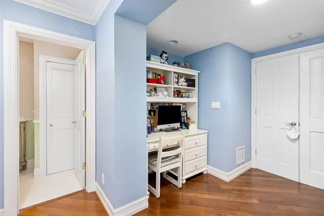 a room with a chair and wooden floor
