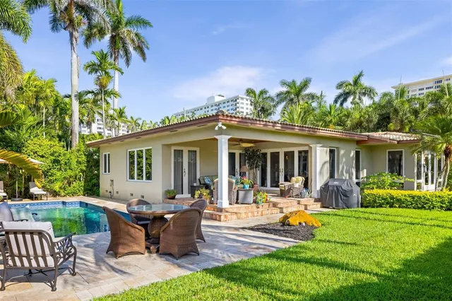 a front view of house with a garden and patio