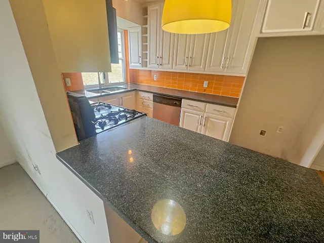 a view of a kitchen from a window