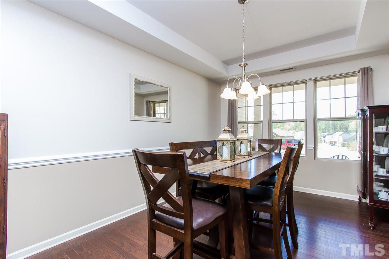 1401 Ranchester Road Knightdale, NC 27545 - Photo 4 of 24 Separate dining room is perfect for hosting dinner parties! Stunning tray ceilings and hardwood flooring.
