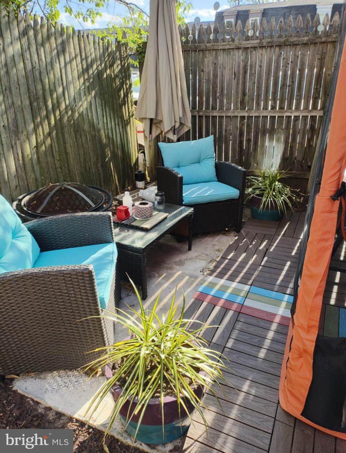 449 Via Cascata Drive Clementon, NJ 08021 - Photo 16 of 16 a view of a chairs and table in backyard