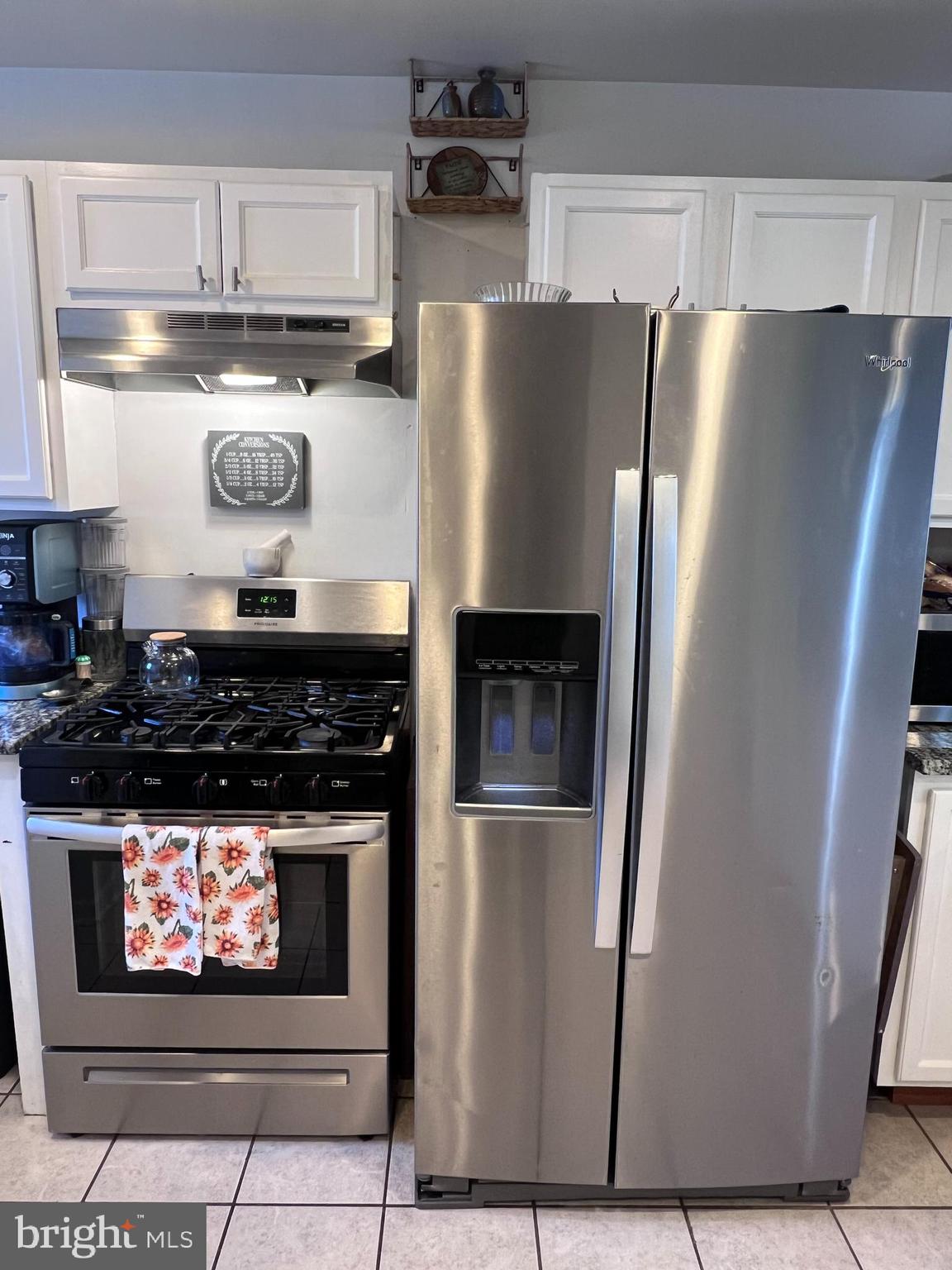 449 Via Cascata Drive Clementon, NJ 08021 - Photo 8 of 16 a metallic refrigerator freezer sitting inside of a kitchen