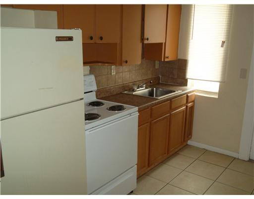1176 West 32nd Street Riviera Beach, FL 33404 - Photo 2 of 10 a utility room with dryer and washer