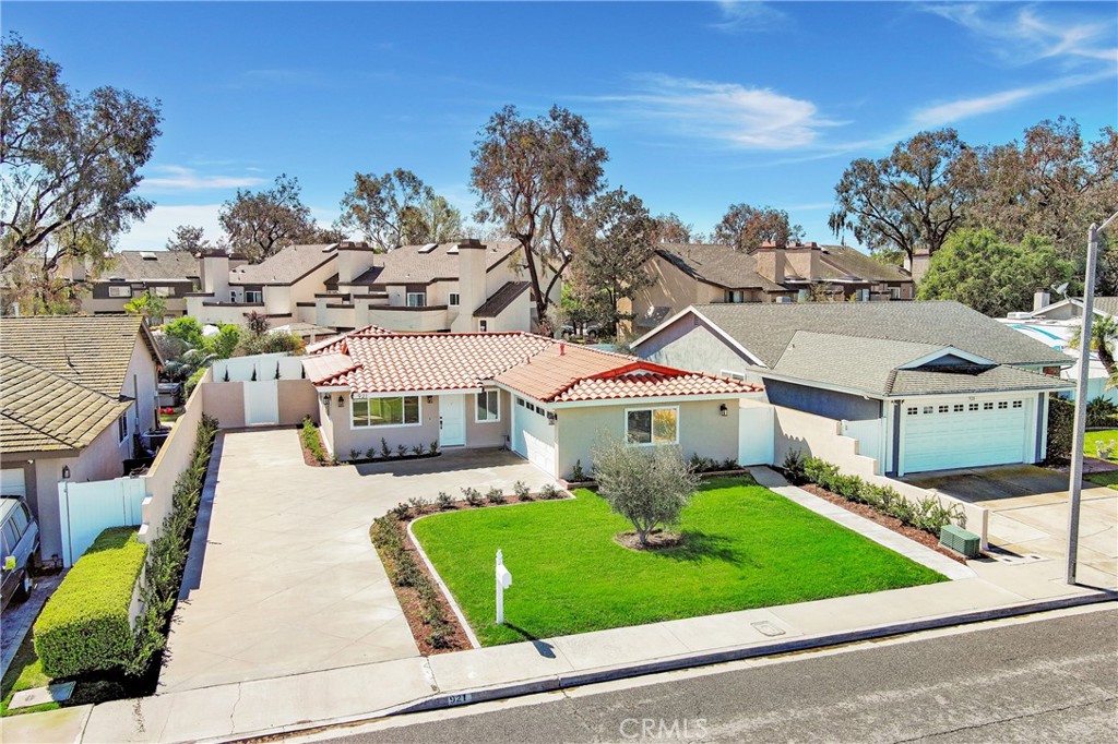 a front view of a house with a yard table and garage