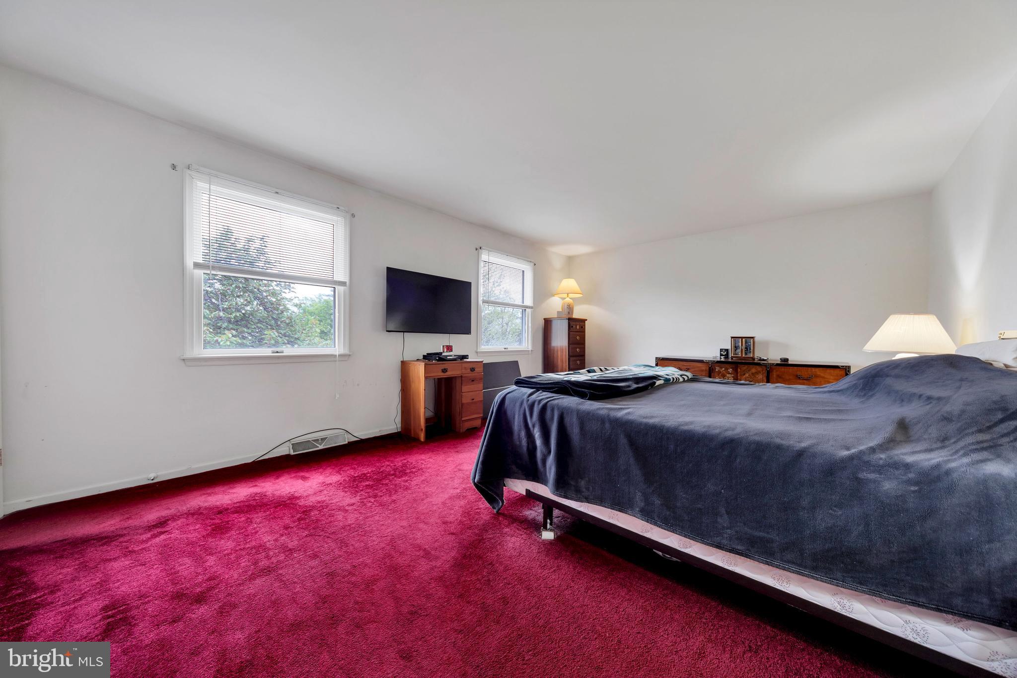 1072 Independence Way Hatfield, PA 19440 - Photo 25 of 37 a spacious bedroom with a bed and a flat screen tv