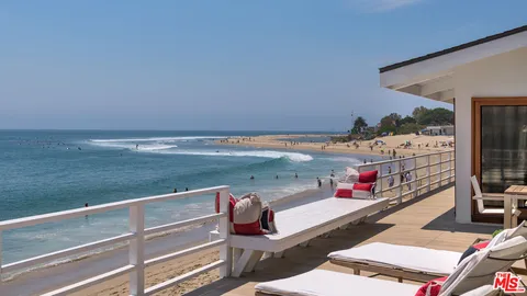 a view of a patio with swimming pool table and chairs
