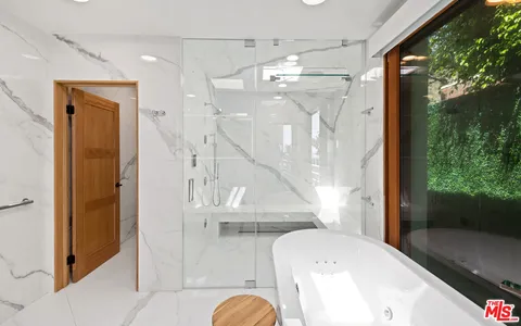 a bedroom with a bed and dresser