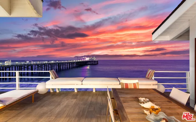 a view of a swimming pool with a lounge chair