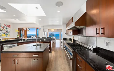 a bathroom with a sink toilet a mirror and tub