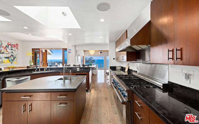 a bathroom with a sink toilet a mirror and tub