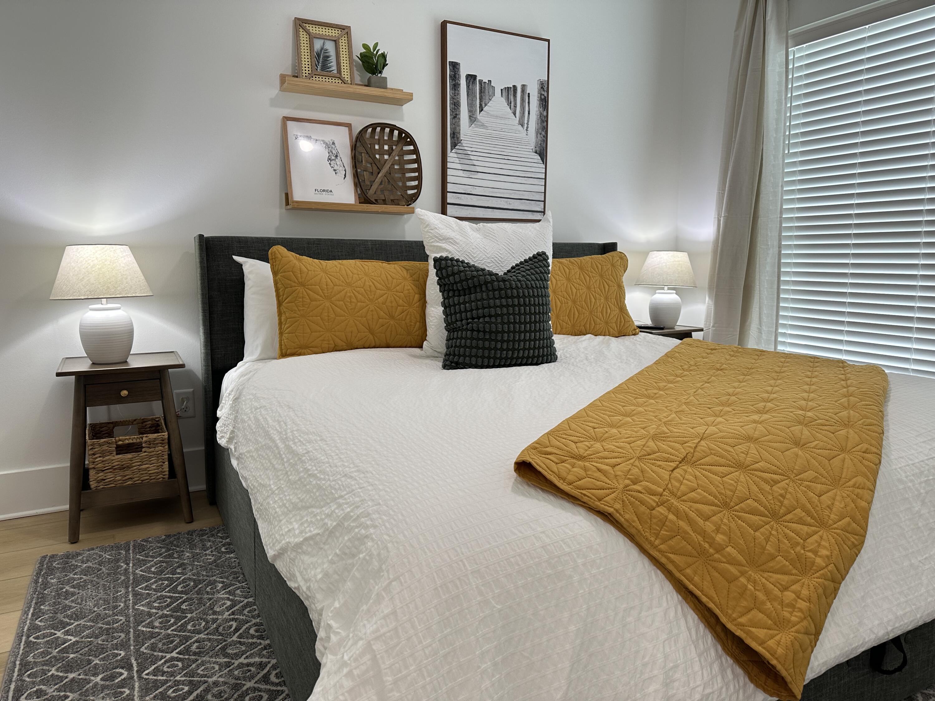 48 Rue Du Soleil Santa Rosa Beach, FL 32459 - Photo 21 of 37 a bedroom with a bed and wooden floor