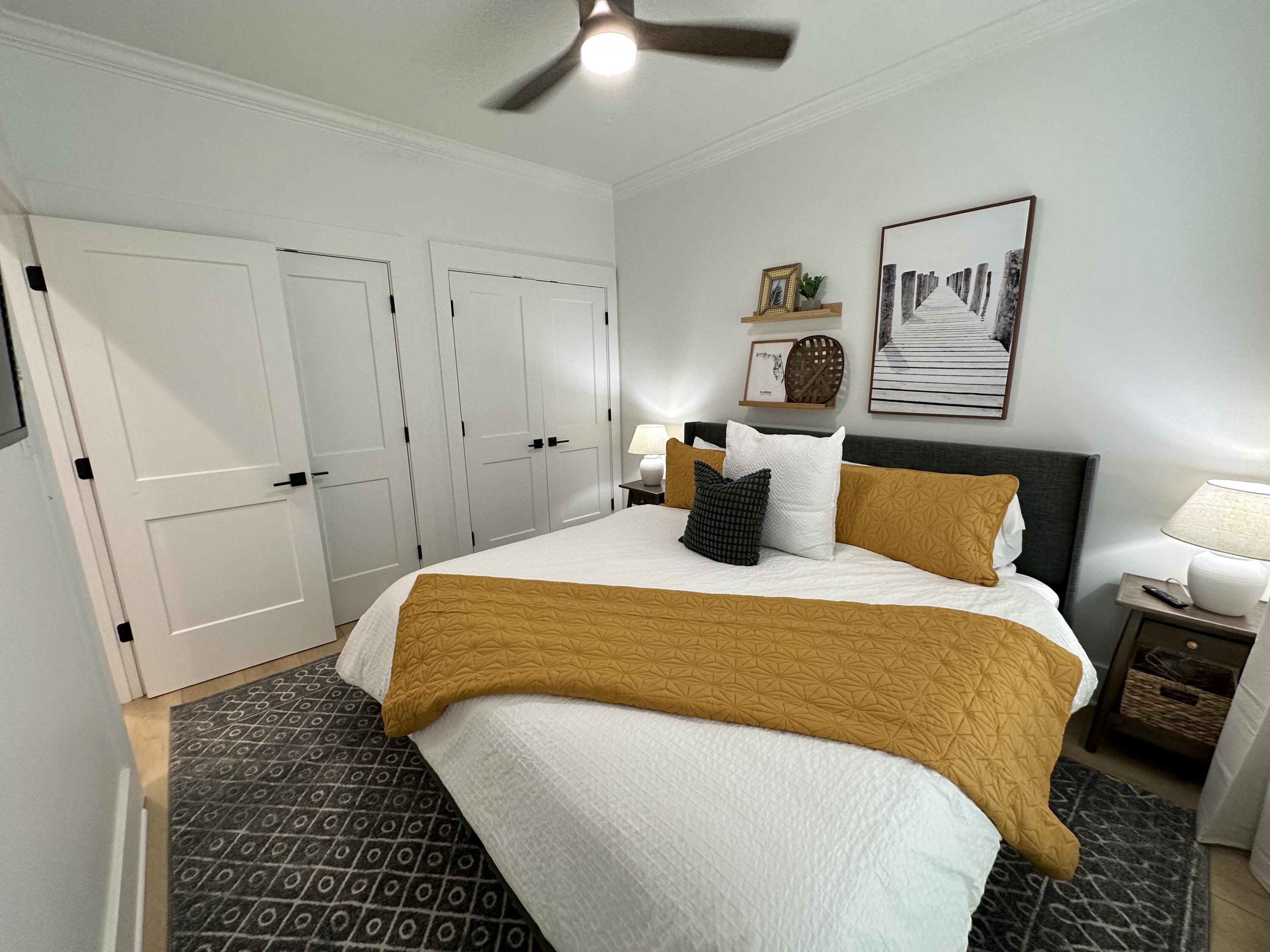 48 Rue Du Soleil Santa Rosa Beach, FL 32459 - Photo 22 of 37 a bedroom with bed and wooden floor