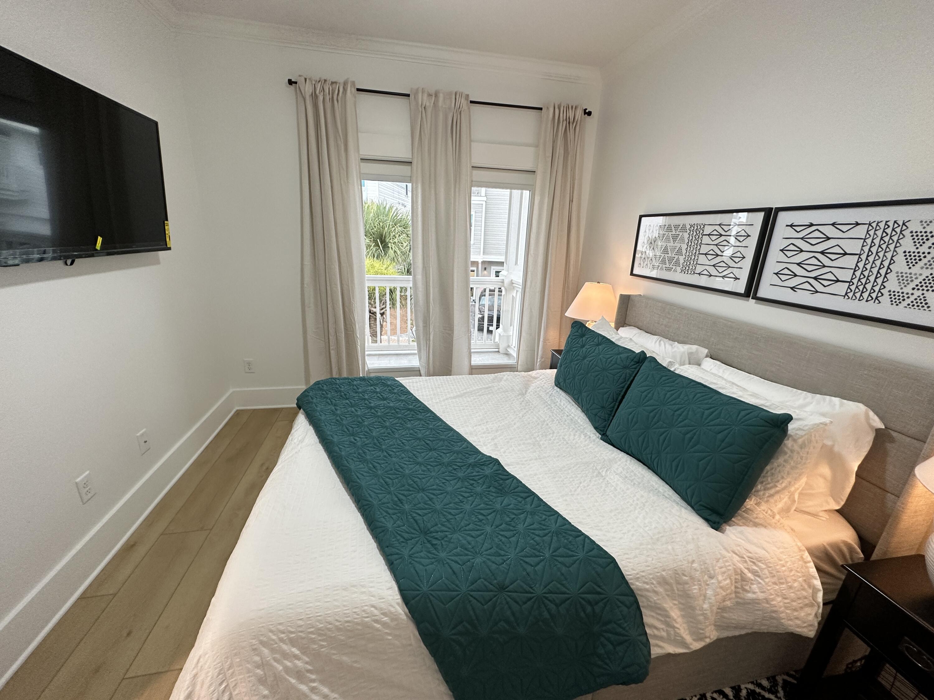 48 Rue Du Soleil Santa Rosa Beach, FL 32459 - Photo 29 of 37 a bedroom with a bed and a flat screen tv