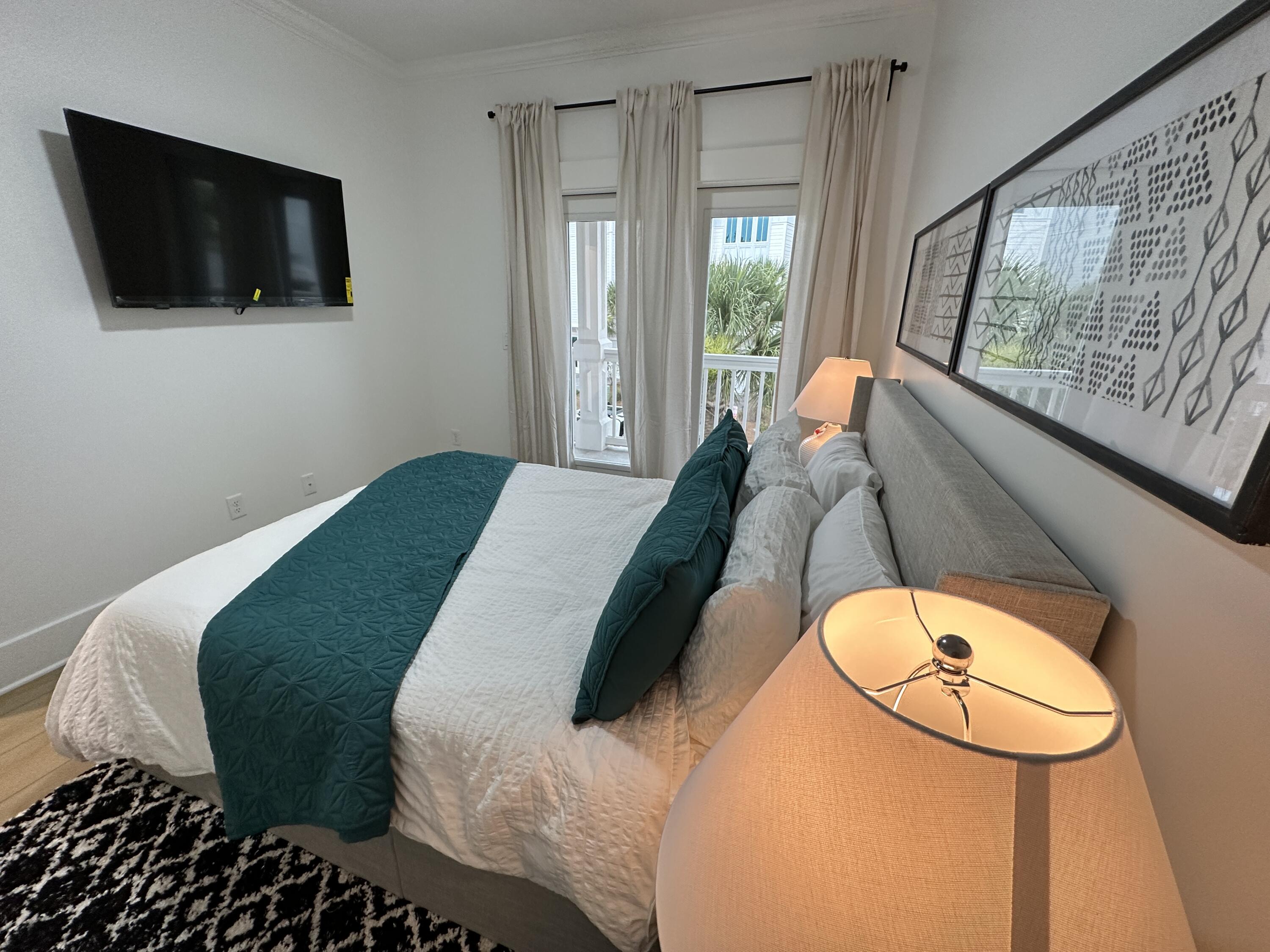 48 Rue Du Soleil Santa Rosa Beach, FL 32459 - Photo 30 of 37 a bedroom with a bed and a flat screen tv