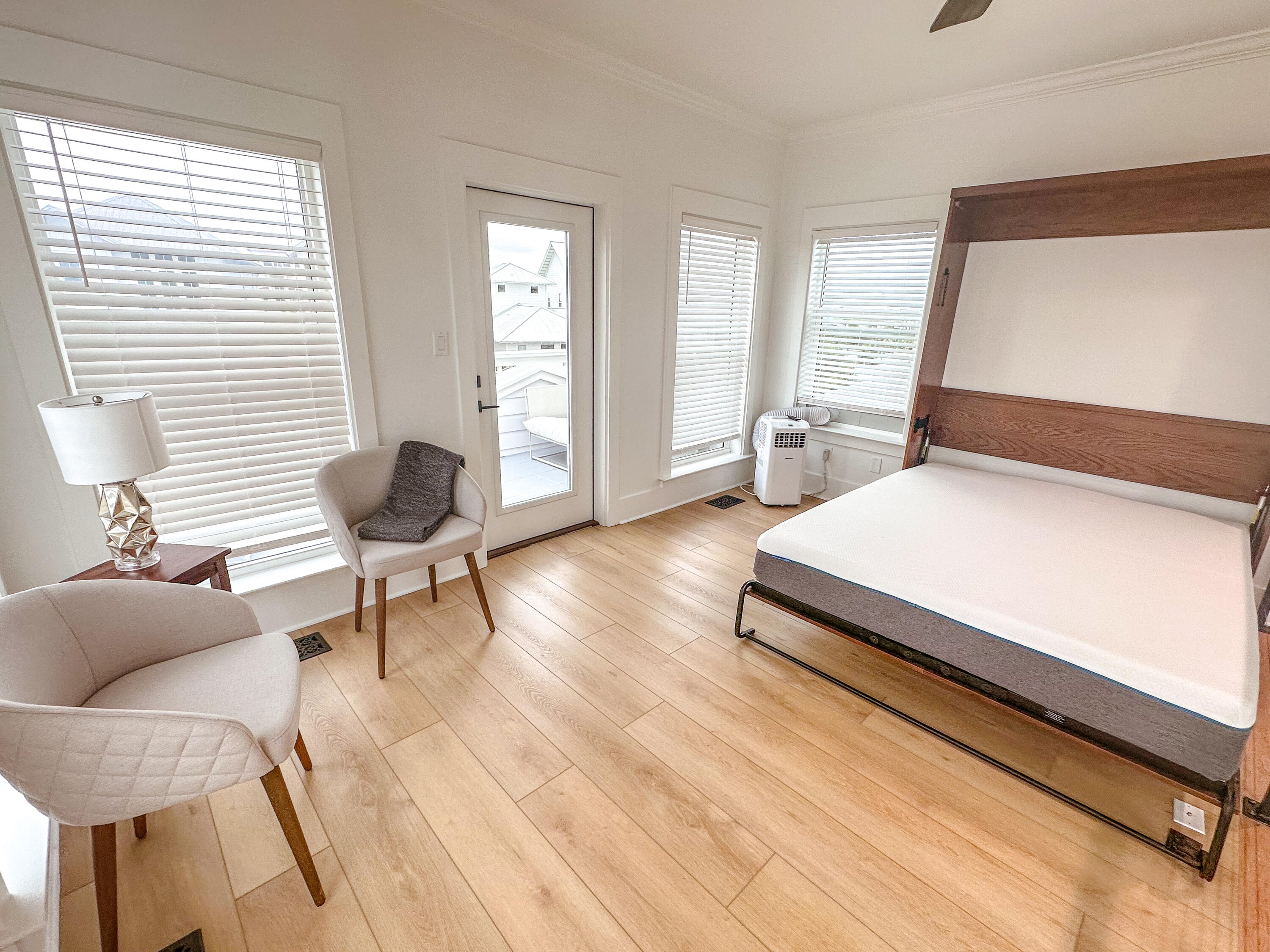 48 Rue Du Soleil Santa Rosa Beach, FL 32459 - Photo 34 of 37 a bedroom with furniture and a window