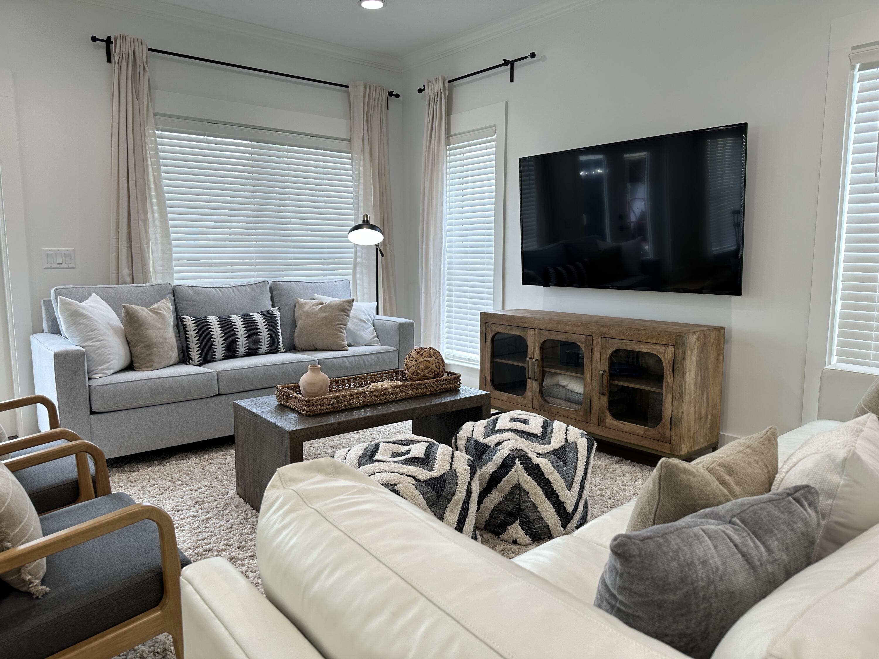 48 Rue Du Soleil Santa Rosa Beach, FL 32459 - Photo 8 of 37 a living room with furniture and a flat screen tv