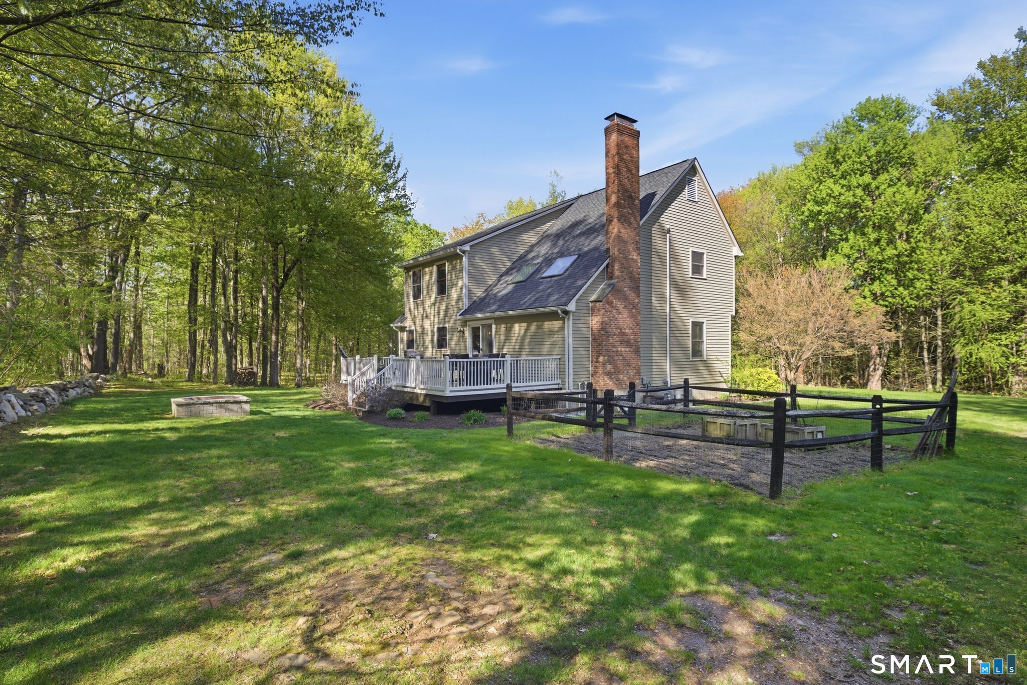 174 Walnut Hill Road Hartland, CT 06027 - Photo 35 of 36 a view of a house with a yard table and chair