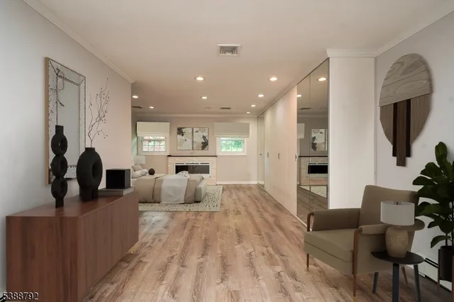 an empty room with windows and fireplace