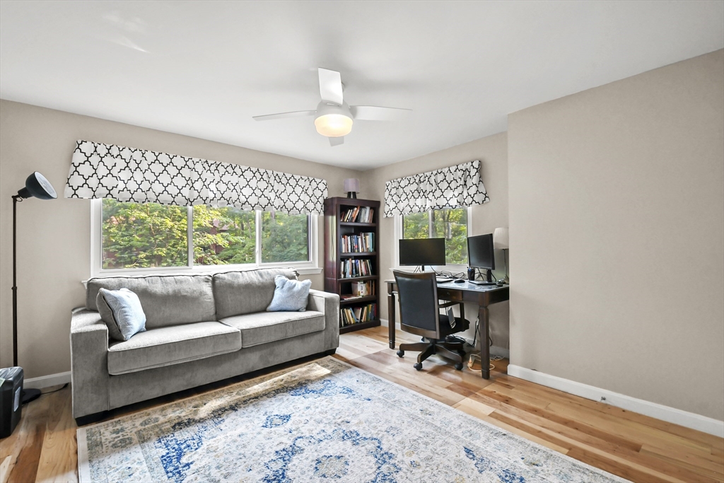 64 Mountain Gate Road, Unit 64 Ashland, MA 01721 - Photo 16 of 31 a living room with furniture and a large window