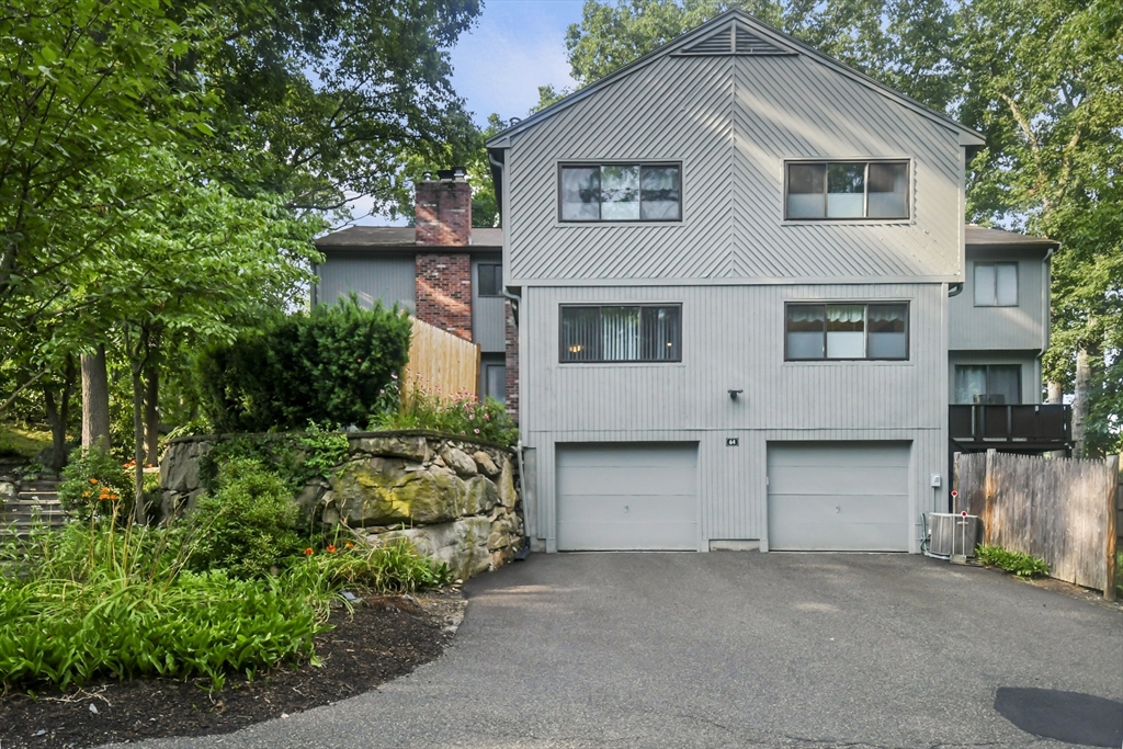 64 Mountain Gate Road, Unit 64 Ashland, MA 01721 - Photo 2 of 31 a house with trees in the background