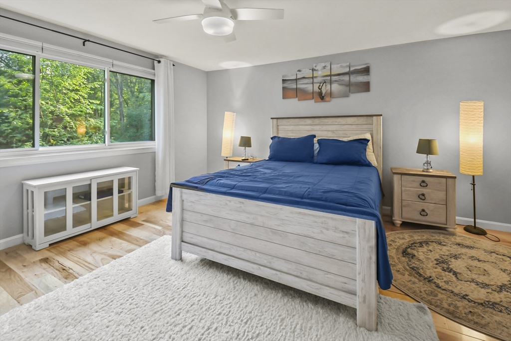 64 Mountain Gate Road, Unit 64 Ashland, MA 01721 - Photo 21 of 31 a bedroom with a bed and a large window