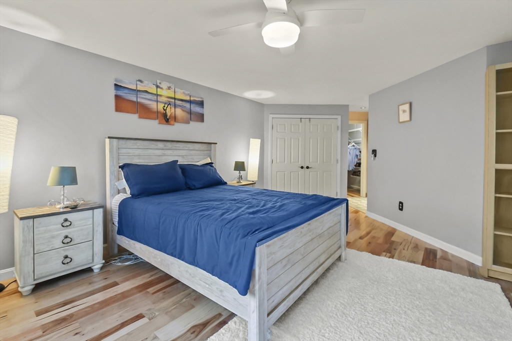 64 Mountain Gate Road, Unit 64 Ashland, MA 01721 - Photo 22 of 31 a bedroom with a bed and a cabinets