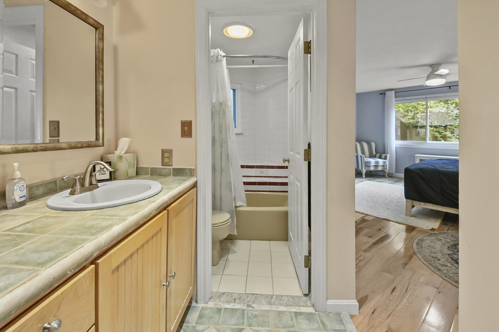 64 Mountain Gate Road, Unit 64 Ashland, MA 01721 - Photo 25 of 31 a bathroom with a sink double vanity and a mirror