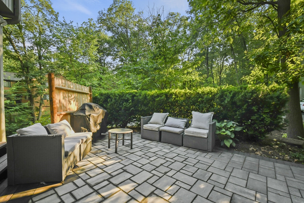 64 Mountain Gate Road, Unit 64 Ashland, MA 01721 - Photo 27 of 31 a view of a patio with a chairs and table in a patio