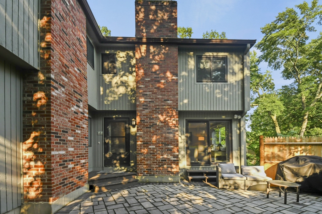 64 Mountain Gate Road, Unit 64 Ashland, MA 01721 - Photo 28 of 31 a front view of a house with outdoor seating