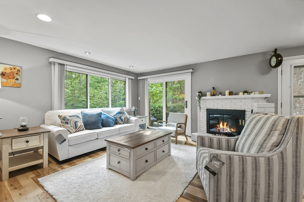 64 Mountain Gate Road, Unit 64 Ashland, MA 01721 - Photo 4 of 31 a living room with furniture and a fireplace