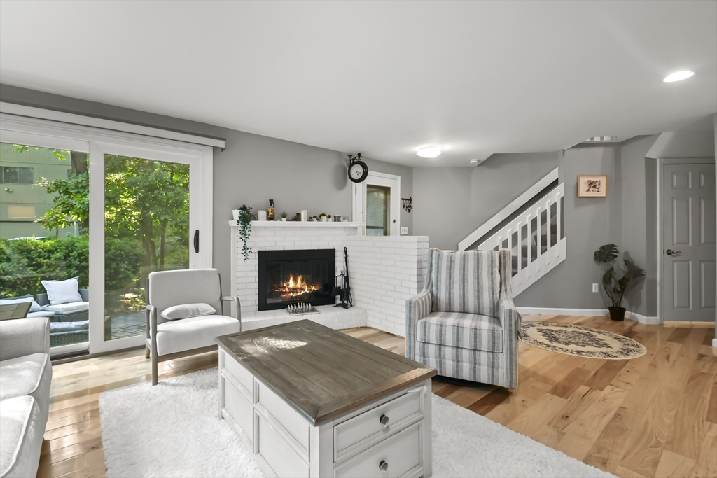 64 Mountain Gate Road, Unit 64 Ashland, MA 01721 - Photo 5 of 31 a living room with furniture and a fireplace