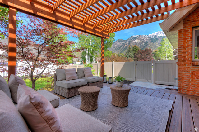 16 Gatehouse Lane Sandy, UT 84092 - Photo 51 of 73 Fenced backyard featuring a pergola, a mountain view, and an outdoor hangout area