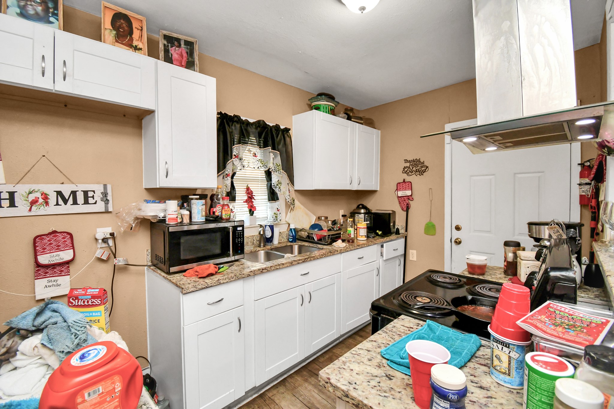 3818 Drew Street Houston, TX 77004 - Photo 16 of 35 a room with storage and utility