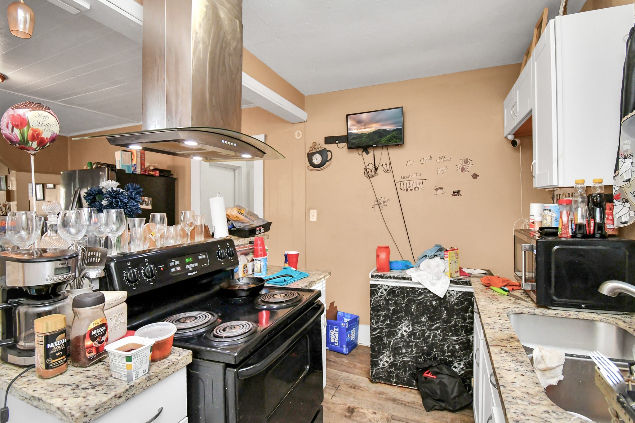 3818 Drew Street Houston, TX 77004 - Photo 18 of 35 a room with furniture a flat screen tv and a fireplace