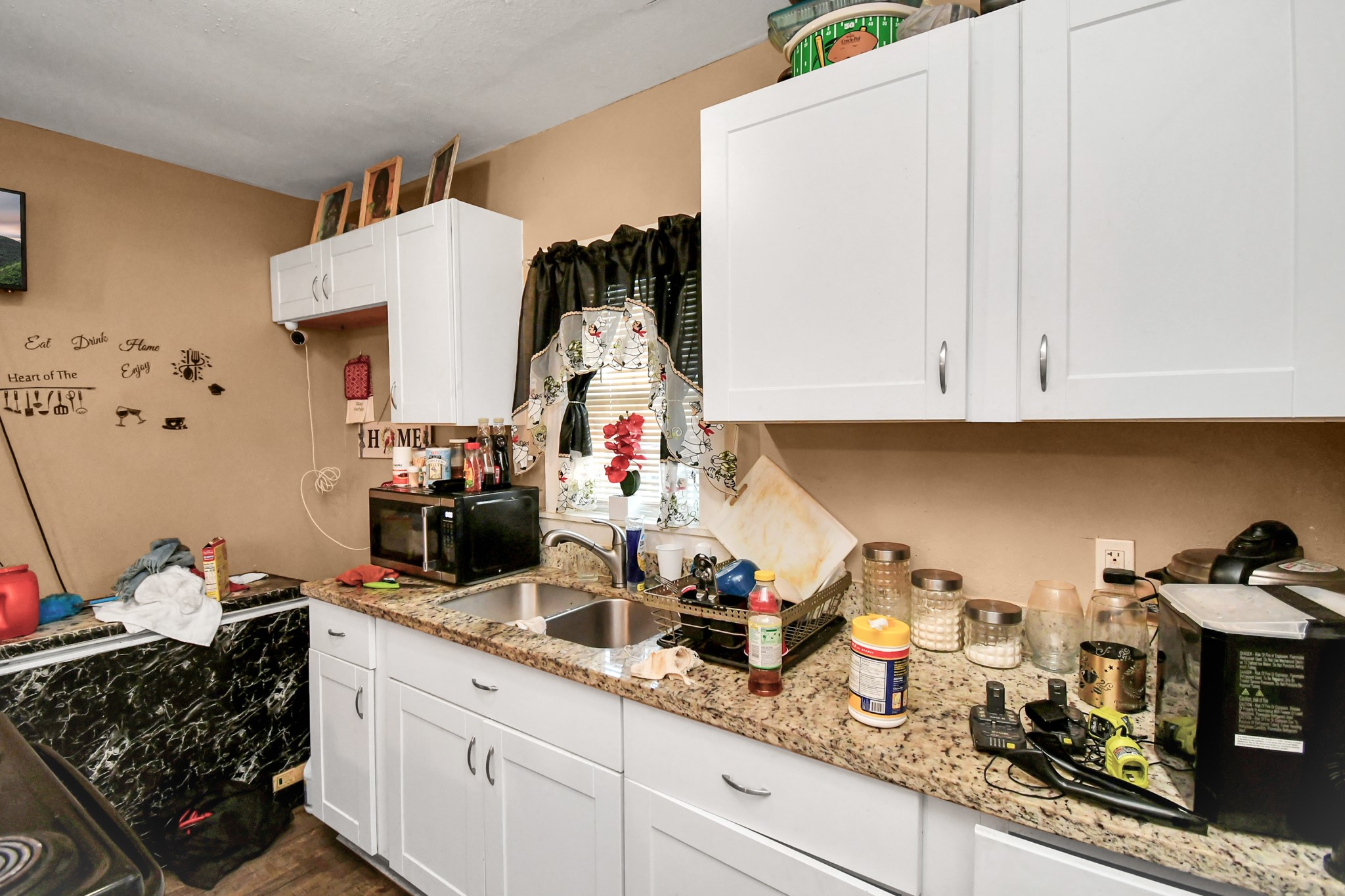 3818 Drew Street Houston, TX 77004 - Photo 20 of 35 a kitchen with sink and cabinets