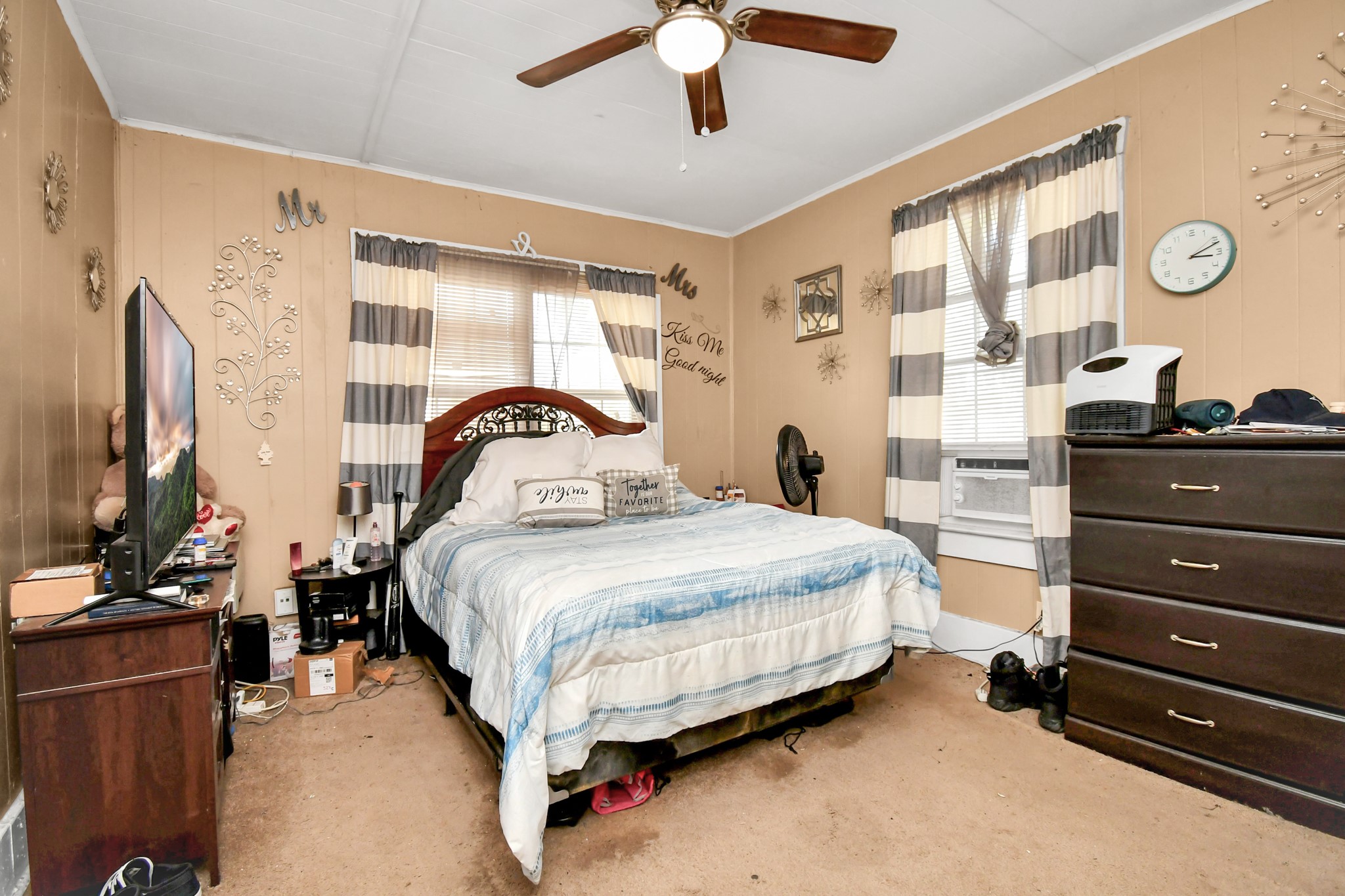 3818 Drew Street Houston, TX 77004 - Photo 23 of 35 a bedroom with a bed and wooden floor