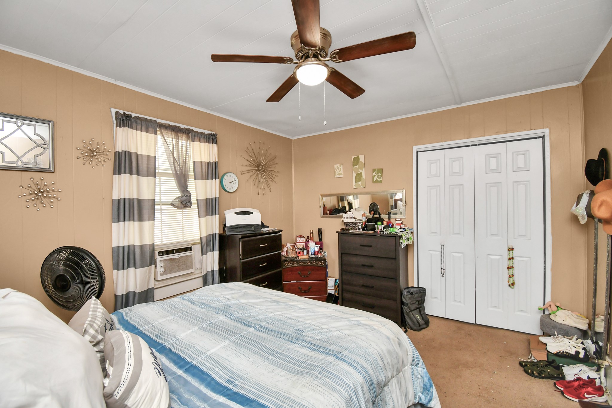3818 Drew Street Houston, TX 77004 - Photo 25 of 35 a bedroom with a bed and wooden floor