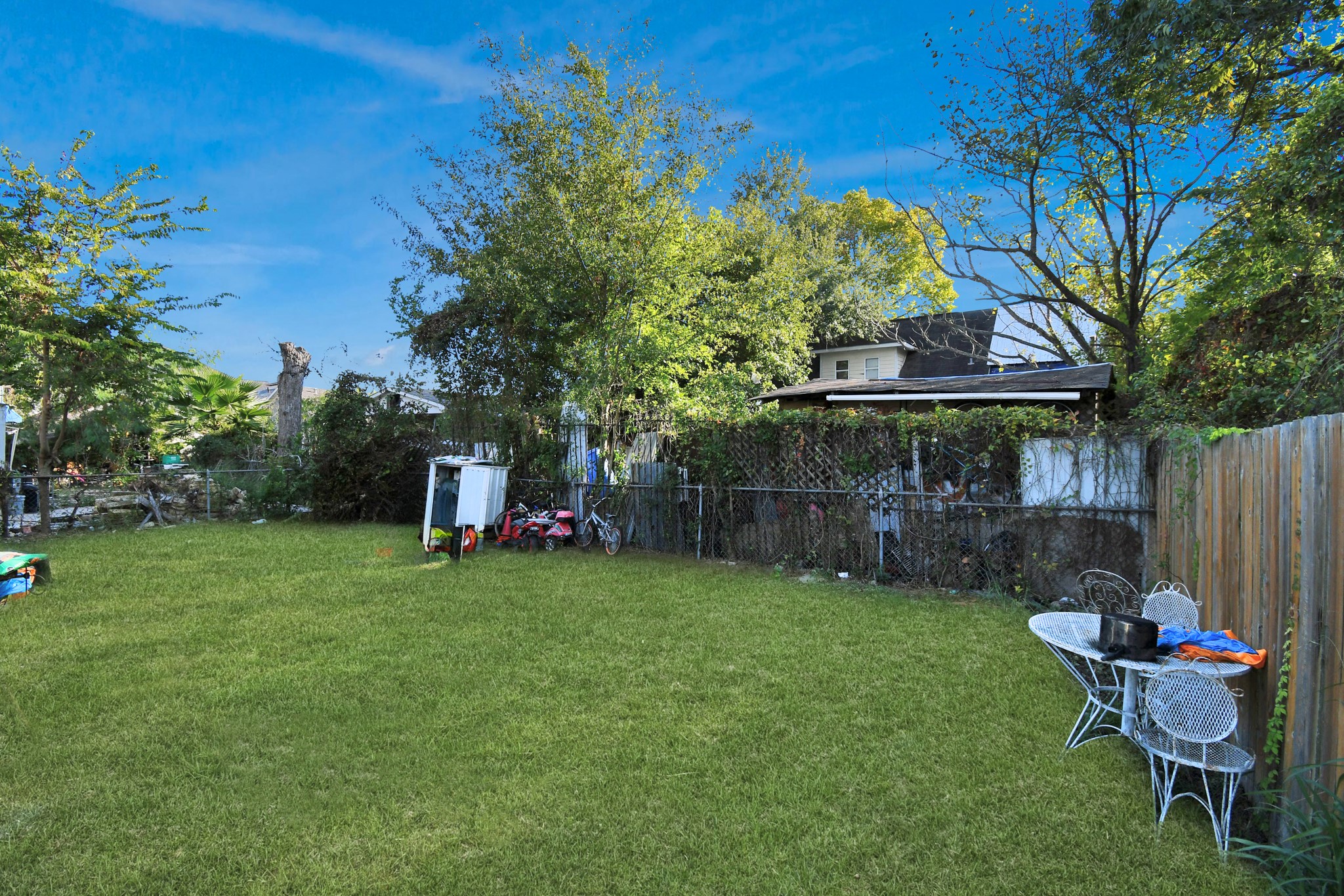 3818 Drew Street Houston, TX 77004 - Photo 28 of 35 a view of a chair and table in backyard of the house