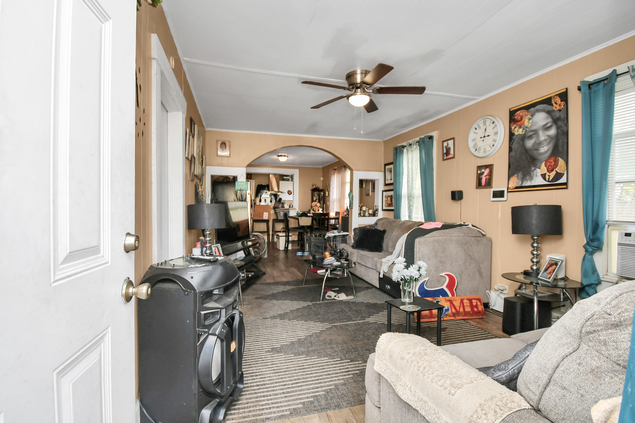 3818 Drew Street Houston, TX 77004 - Photo 6 of 35 a living room with furniture a flat screen tv and a window