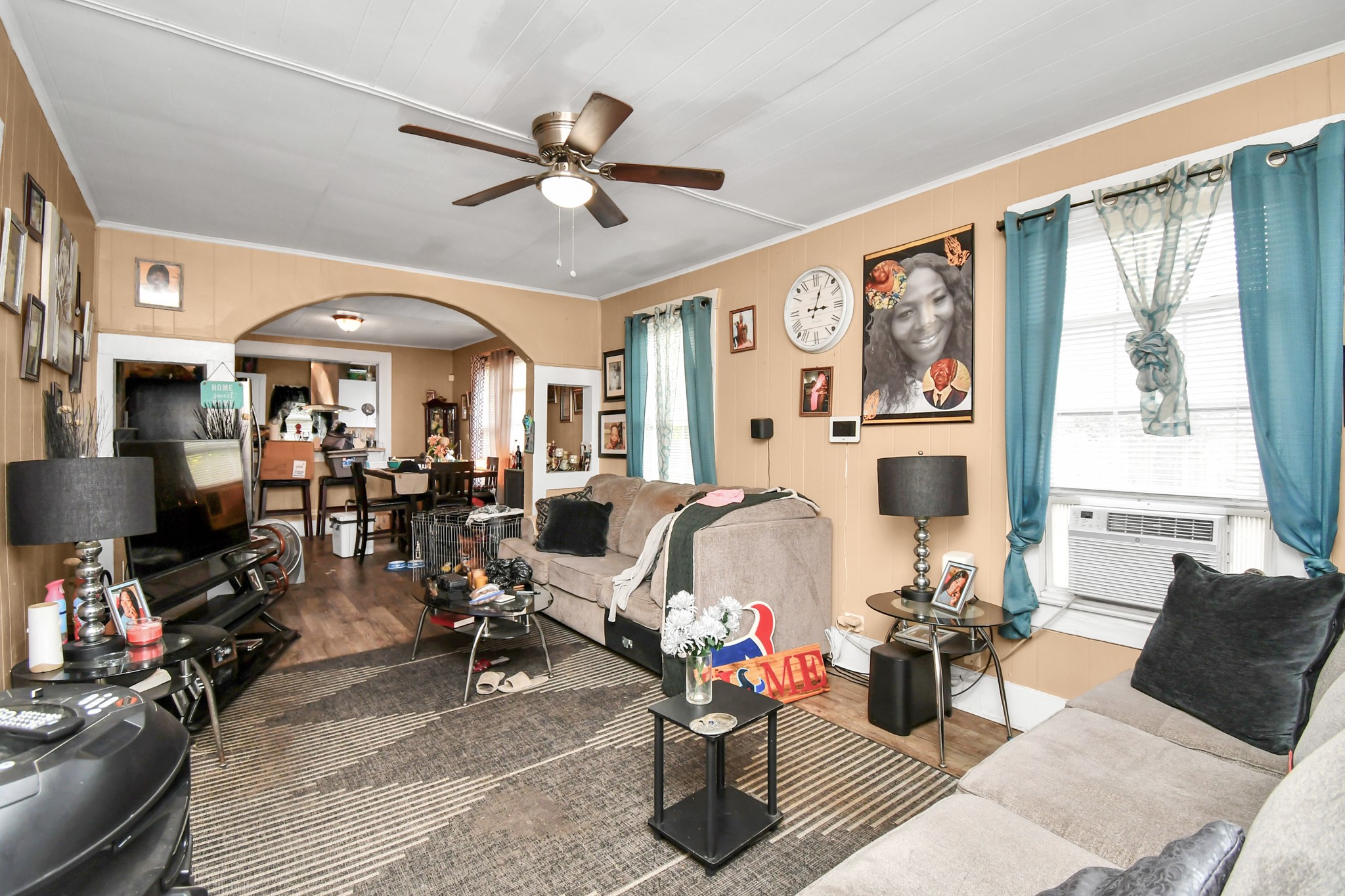 3818 Drew Street Houston, TX 77004 - Photo 7 of 35 a living room with furniture a flat screen tv and a large window