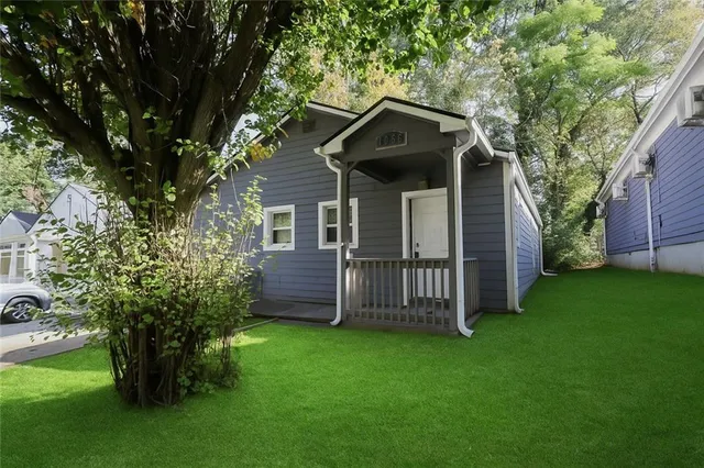 a front view of a house with garden