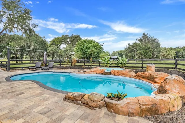 a outdoor space with the couches and pool