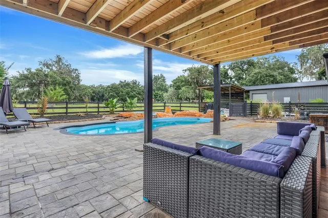 a view of a park with a house in the background