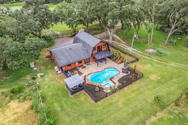 a view of a park with large trees